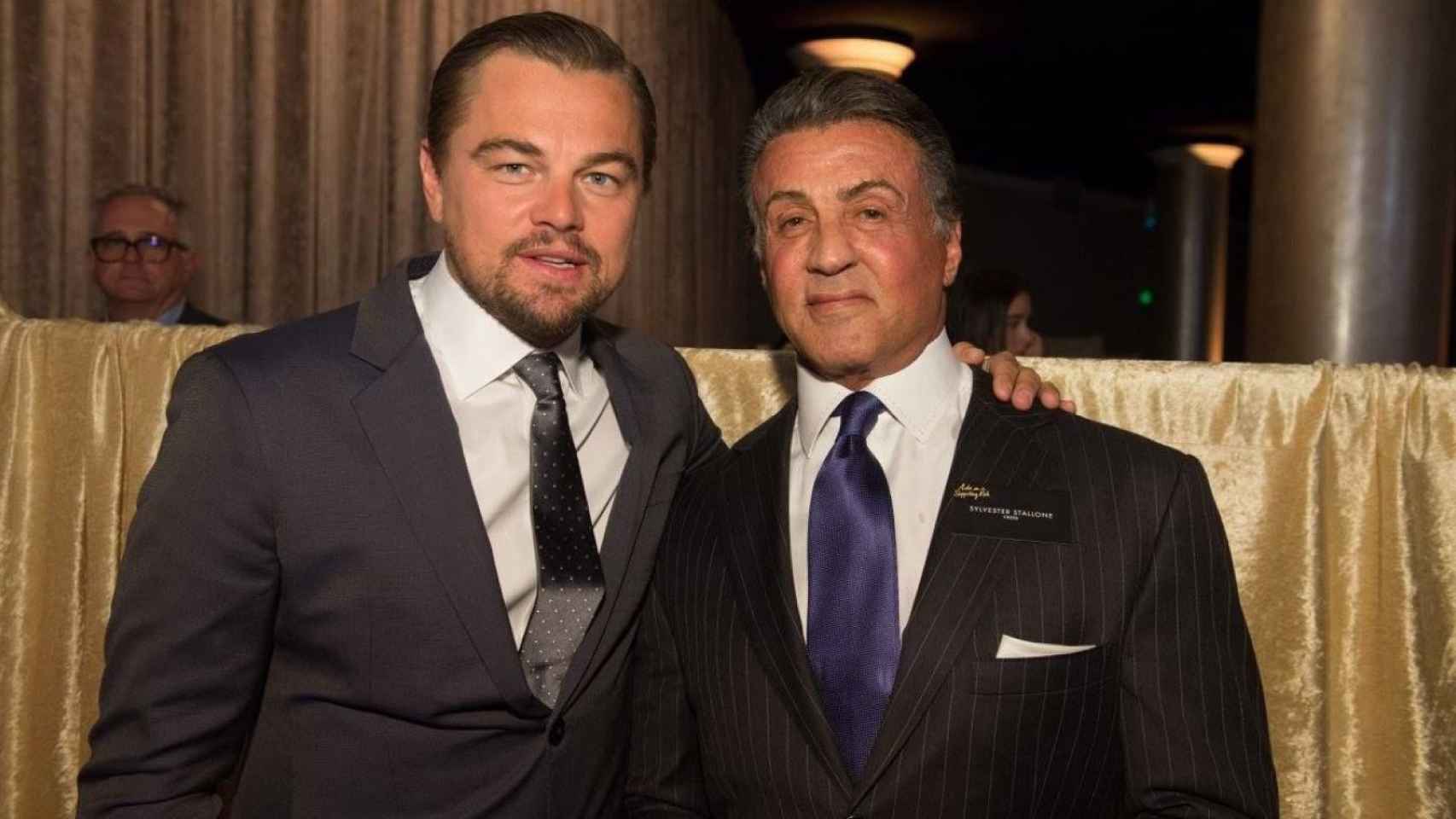 Leonardo DiCaprio con Sylvester Stallone en la cena de nominados