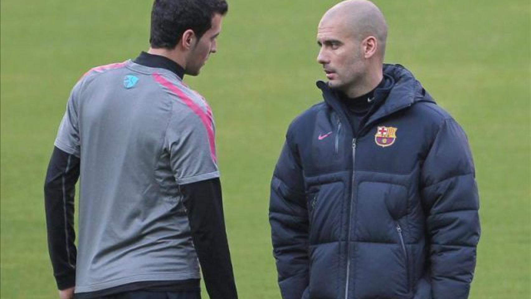 Busquets y Guardiola, durante un entrenamiento del Barça.