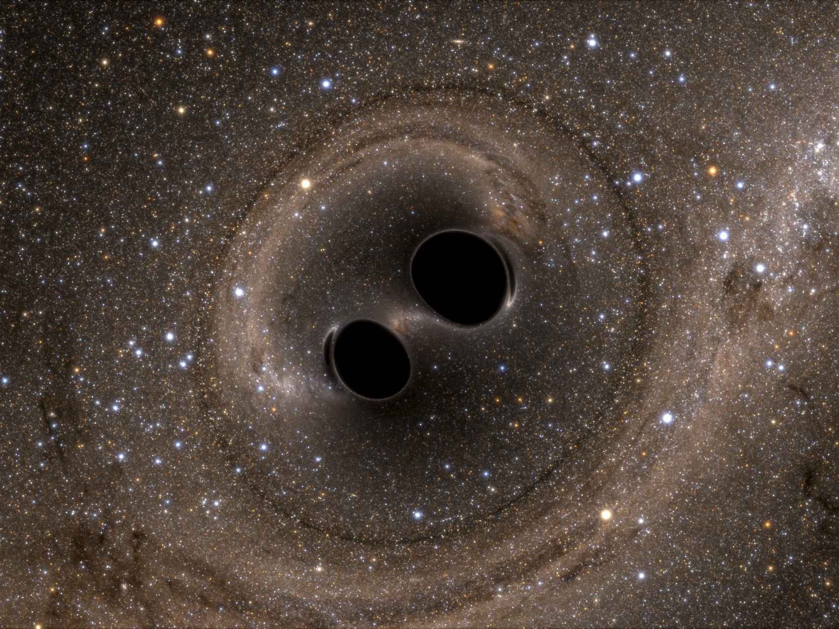 El choque de dos agujeros negros provocaron las ondas gravitacionales detectadas.