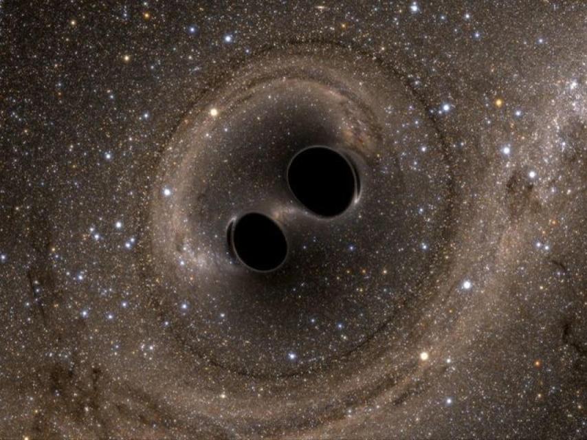 El choque de dos agujeros negros provocaron las ondas gravitacionales detectadas.