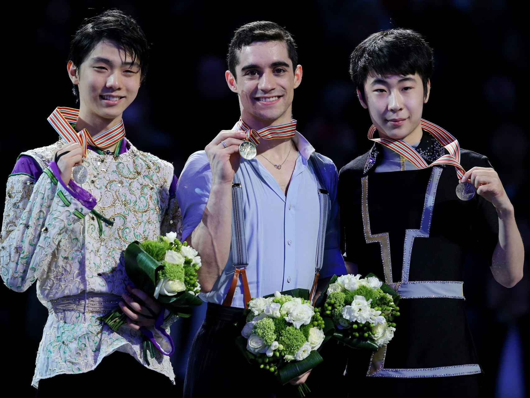 Hanyu, Fernández y Jin en el podio mundial de Boston.