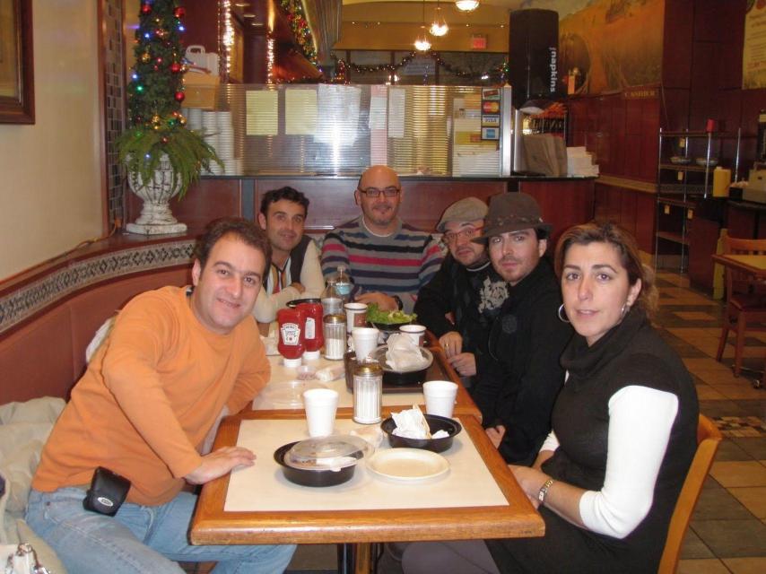 Susana Díaz y su marido (de naranja) en un viaje a Nueva York en 2010.