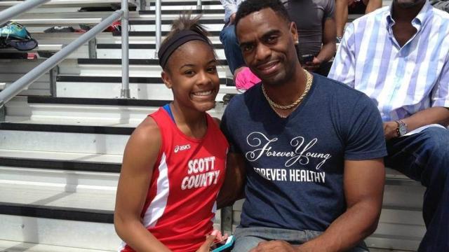 Tyson Gay, junto a su hija Trinity.