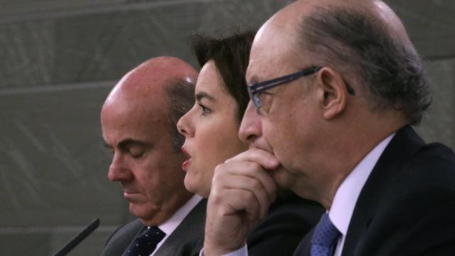 Luis de Guindos, Soraya Sáez y Cristobal Montoro en una imagen de archivo.