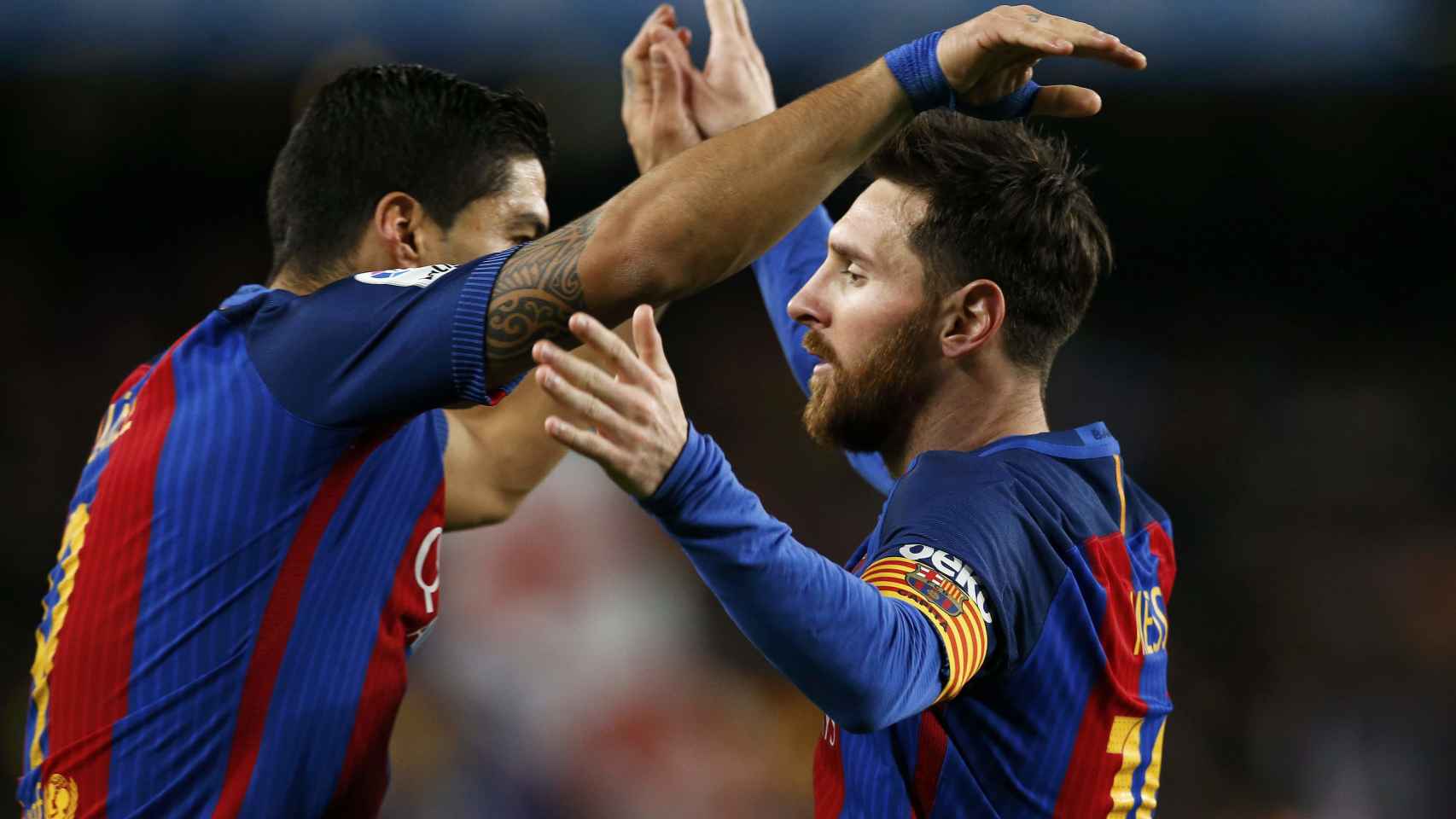 Suárez y Messi celebran un gol contra el Atlético.