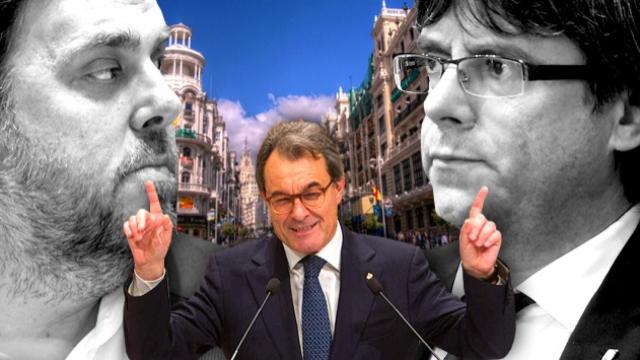 Oriol Junqueras, Artur Mas y  Carles Puigdemont. De fondo la Gran Via de Madrid.