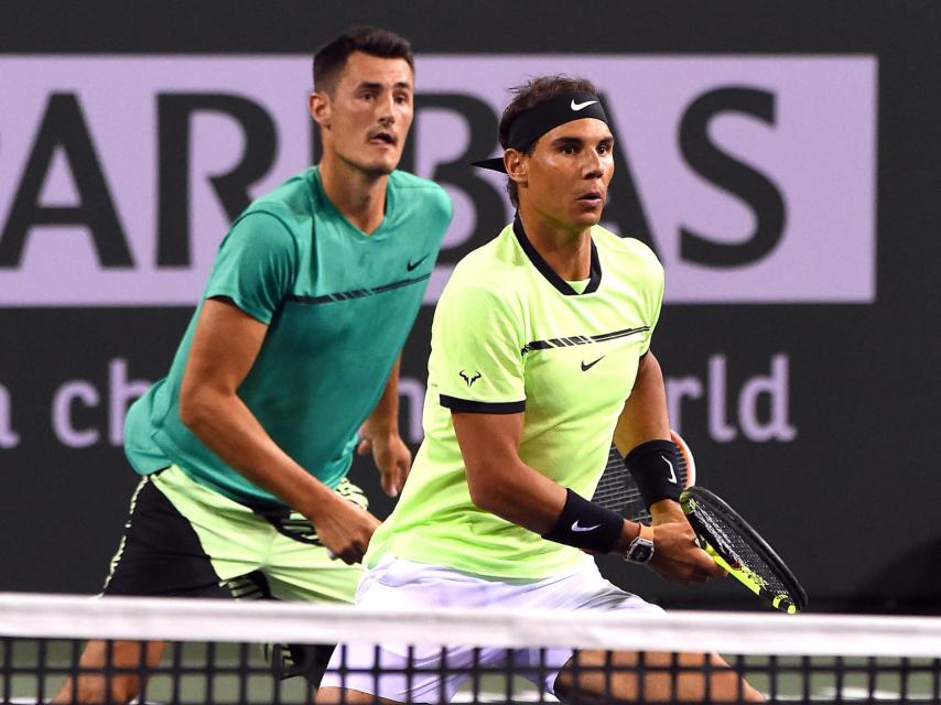 Bernard Tomic y Rafa Nadal en un partido de dobles en Indian Wells.