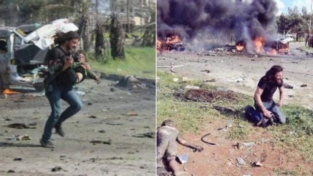 El fotógrafo Abd Alkader Habak en el momento de sacar al niño en brazos.