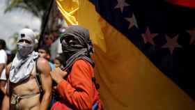Manifestantes durante una homenaje a las víctimas de las protestas en Venezuela