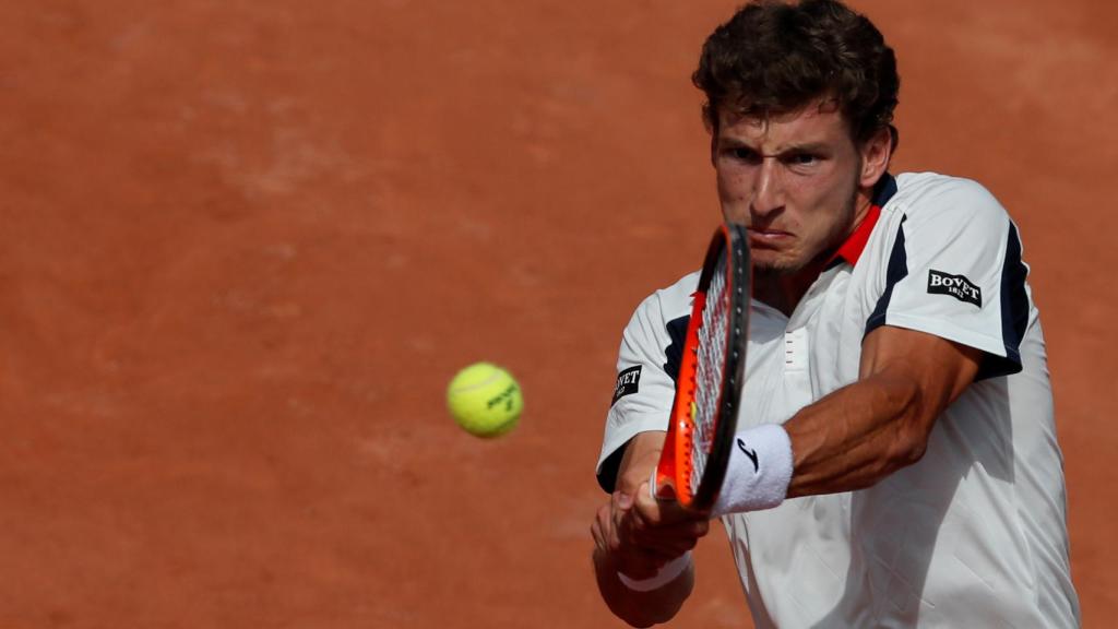 Carreño, golpeando un revés ante Raonic.