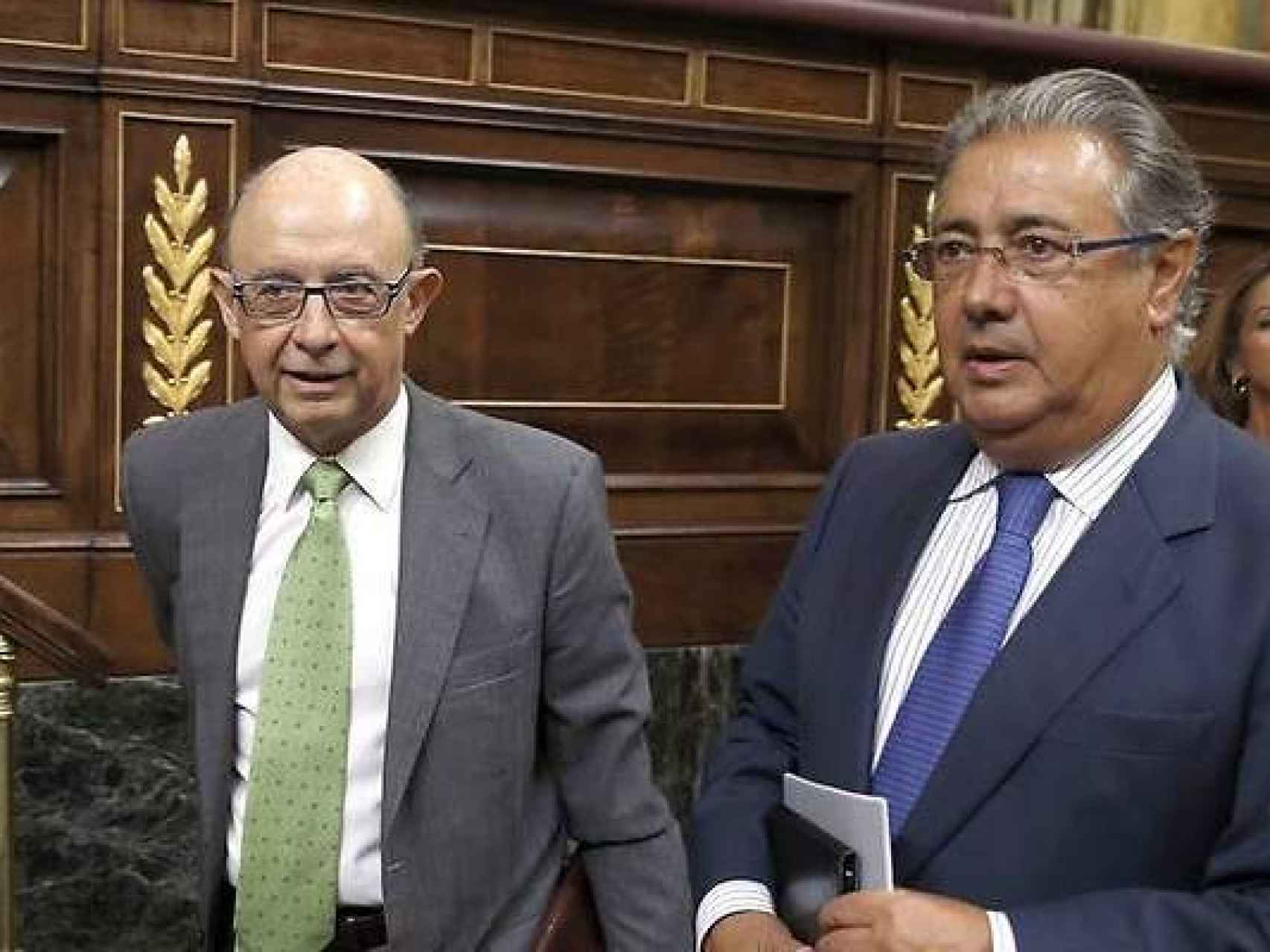 Cristóbal Montoro y Juan Ignacio Zoido, los ministros insultados este miércoles.