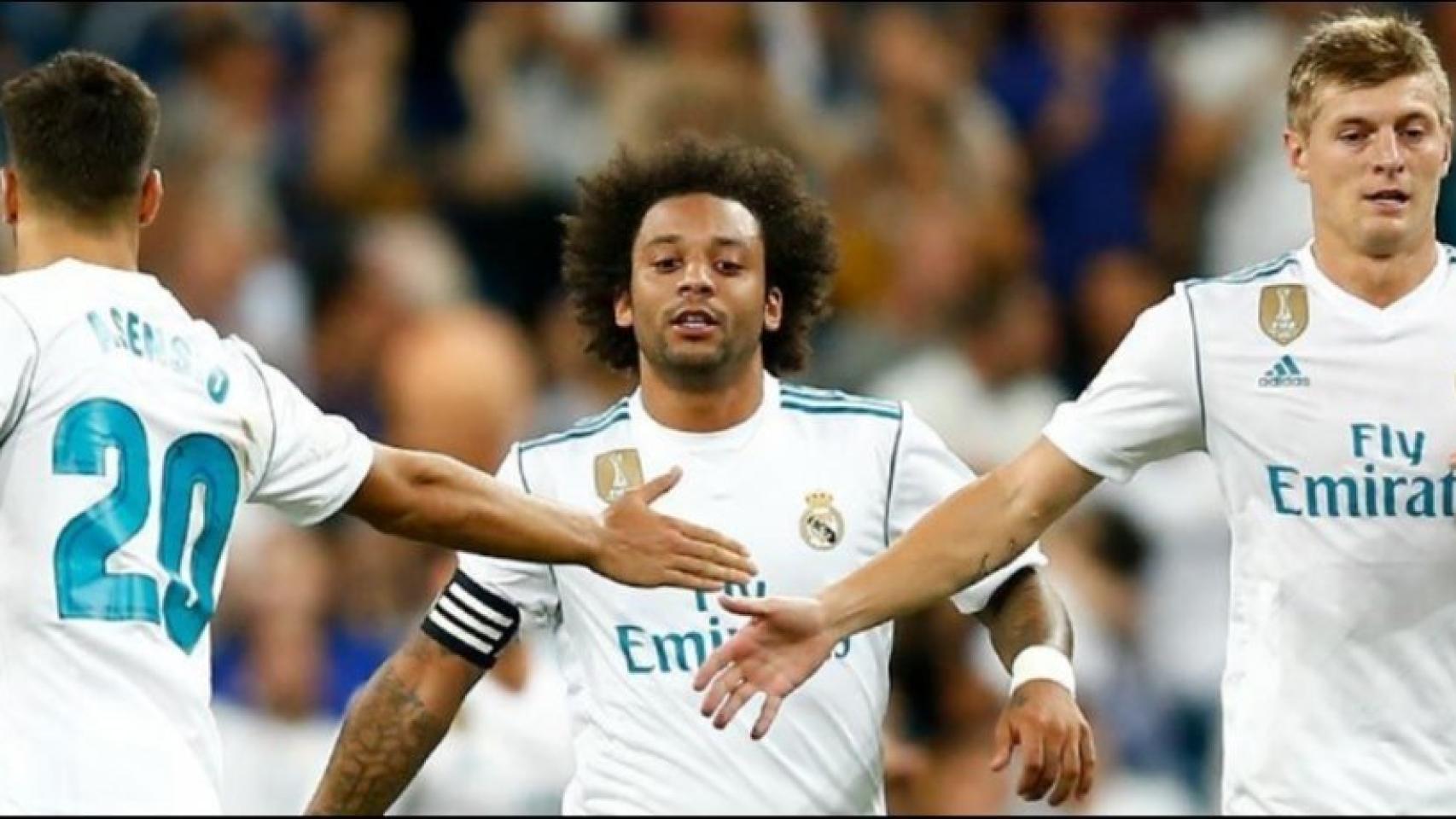 Marcelo junto a Asensio y Kroos