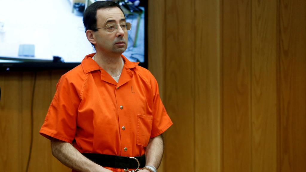 FILE PHOTO:    Larry Nassar, a former team USA Gymnastics doctor who pleaded guilty in November 2017 to sexual assault charges, stands in court during his sentencing hearing in the Eaton County Court in Charlotte