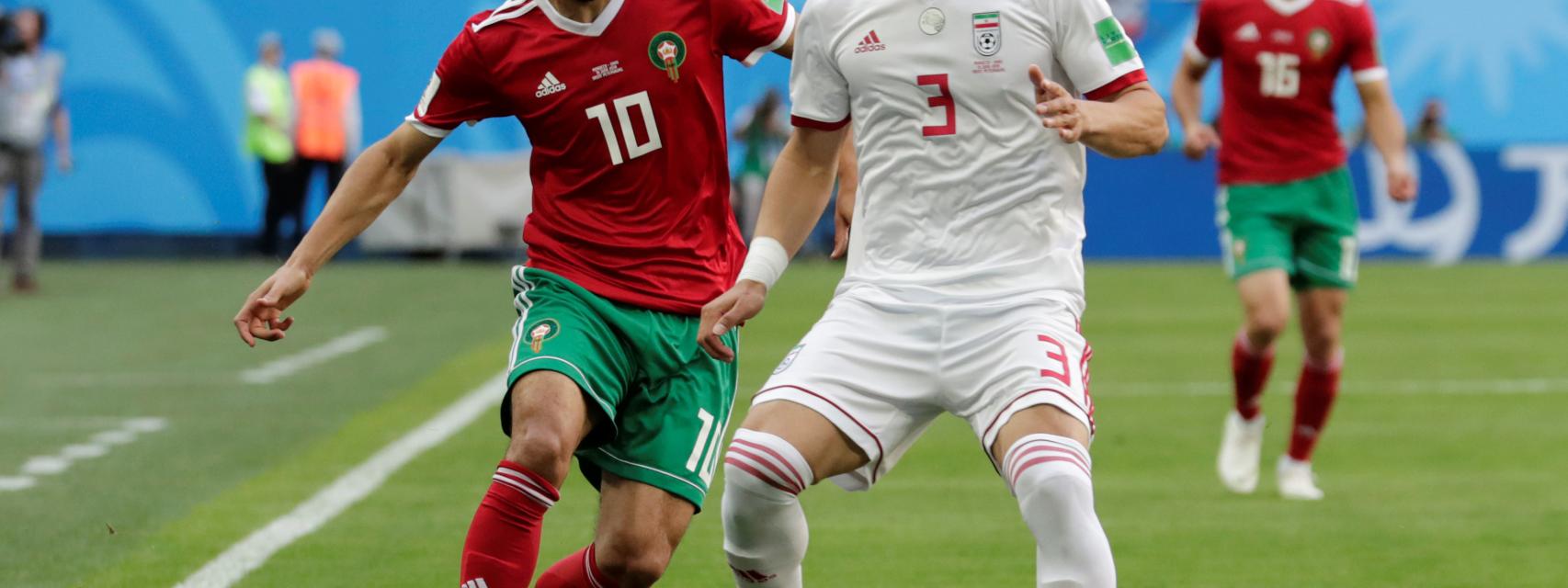 Hajsafi y Belhanda durante el partido.