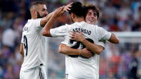 Odriozola y Benzema celebran con Asensio su gol