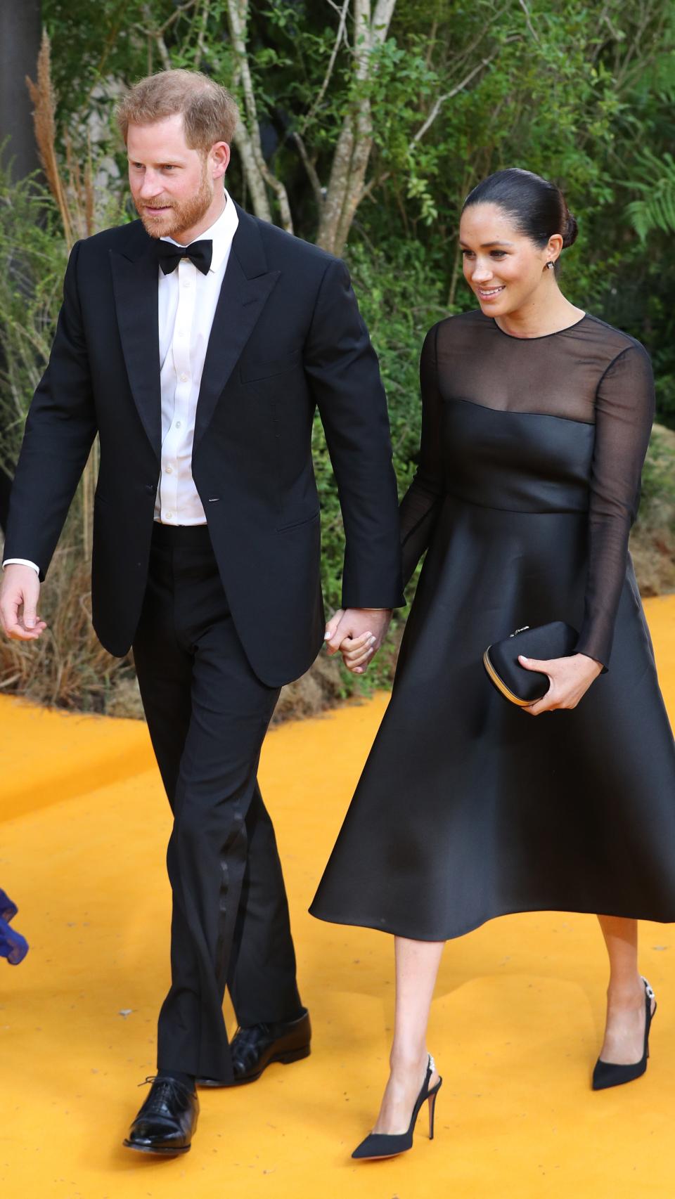 Harry de Inglaterra y Meghan Markle en el estreno de 'El Rey León'.