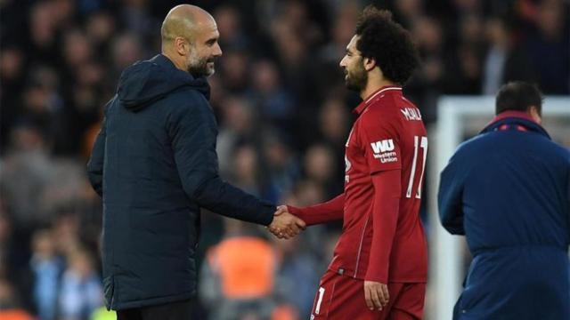 Guardiola y Salah, durante un partido