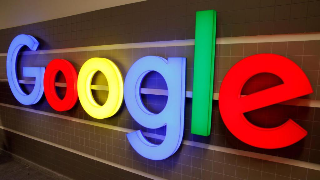 FILE PHOTO: An illuminated Google logo is seen inside an office building in Zurich