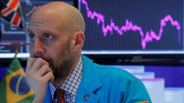 Specialist trader works at his post on the floor at the NYSE in New York