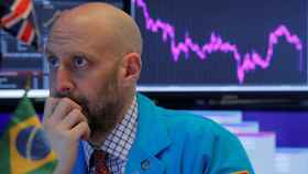 Specialist trader works at his post on the floor at the NYSE in New York