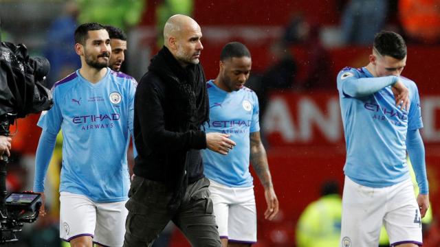 Pep Guardiola, Ilkay Gundogan, Raheem Sterling y John Stones, durante un partido del Manchester City