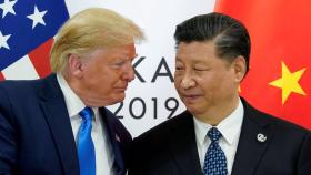 Donald Trump, junto a Xi Jinping. Reuters