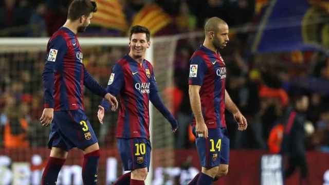 Gerard Piqué, Leo Messi y Javier Mascherano, en un partido del Barcelona
