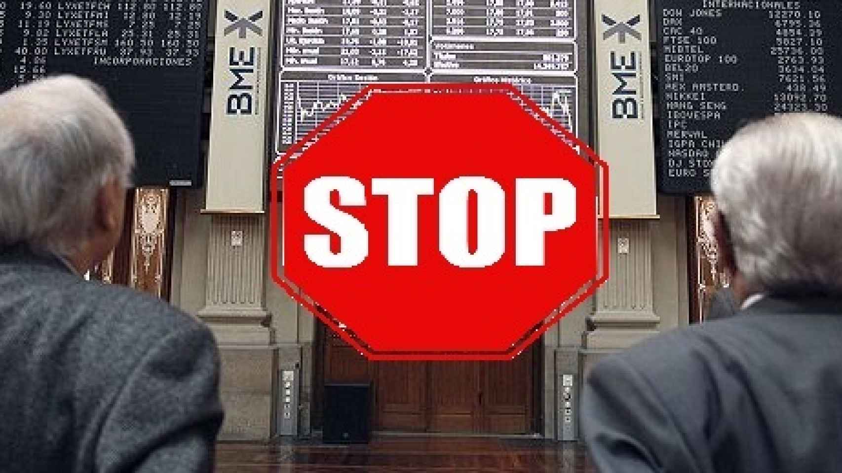 Una señal de 'stop' sobre una imagen de archivo de la Bolsa de Madrid.