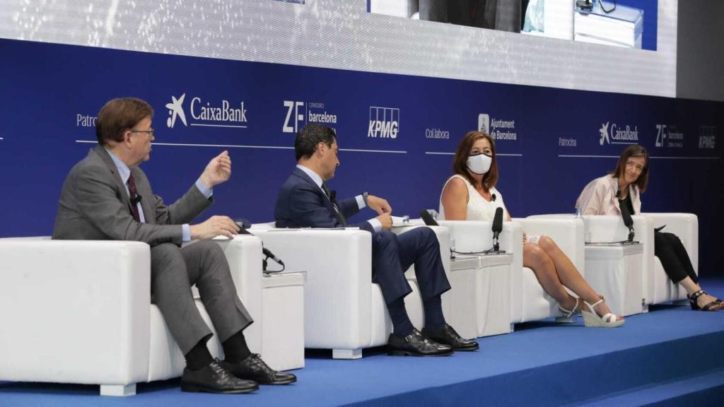 Ximo Puig, Juanma Moreno y Francina Armengol, durante el evento. EE