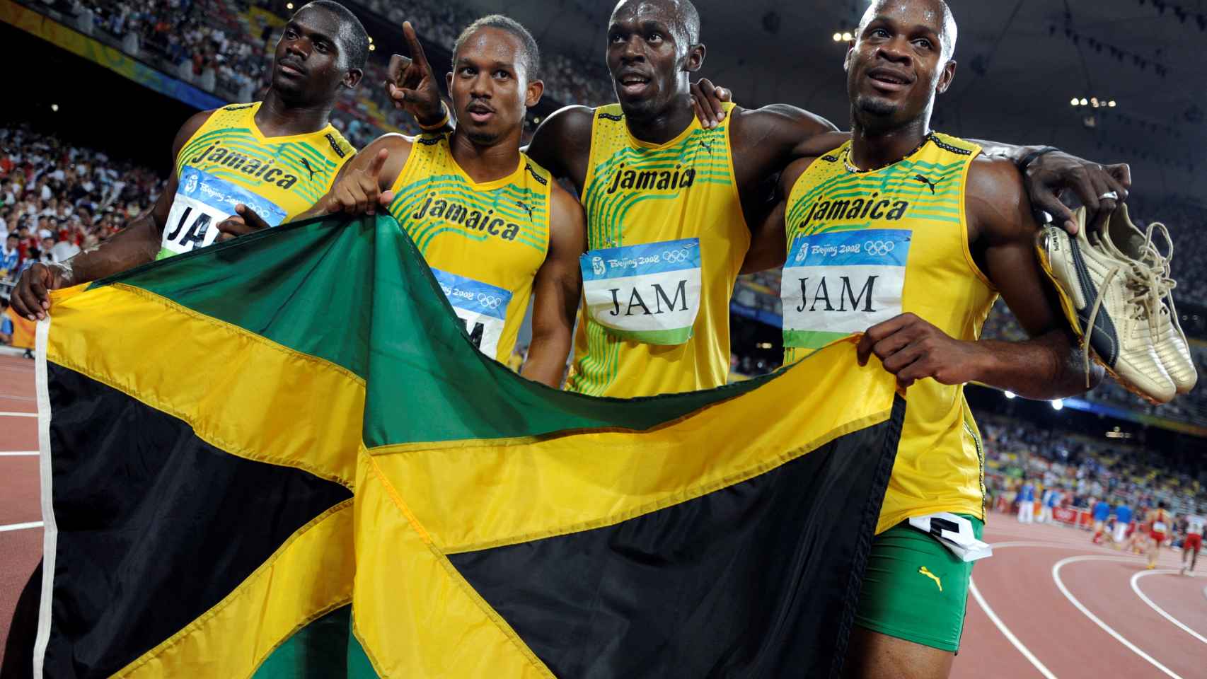 El equipo jamaicano del 4x100 con Usain Bolt y Nesta Carter