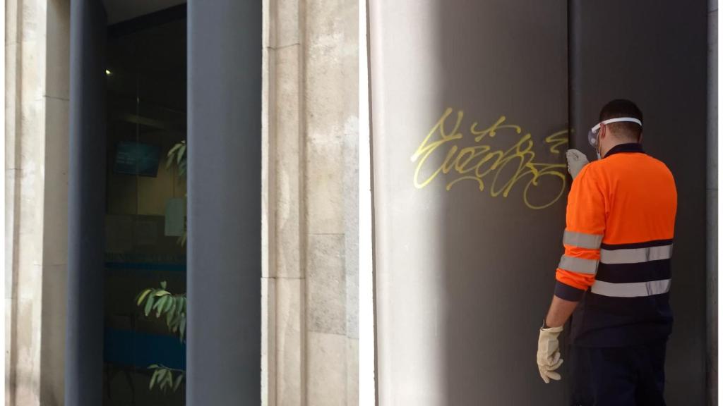 Un empleado limpia la fachada del edificio del Ayuntamiento en Alicante.