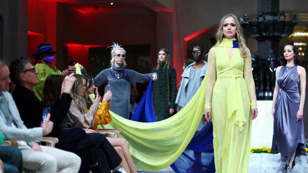 Ukraine refugee and dancer Nataliia Ovcharova presents creations by designer Anja Gockel for the show Weltgewandt in Hotel Adlon, during Fashion Week in Berlin, Germany, March 15, 2022.