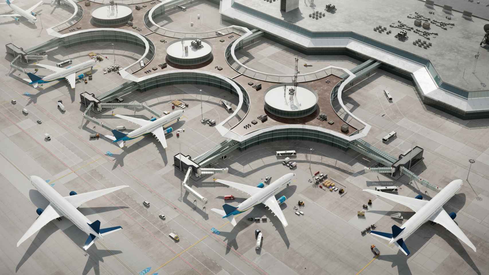 Vista de pájaro de la terminal de un aeropuerto con aviones estacionados.