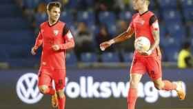 Febas y Roberto tras el gol del Málaga en Las Palmas