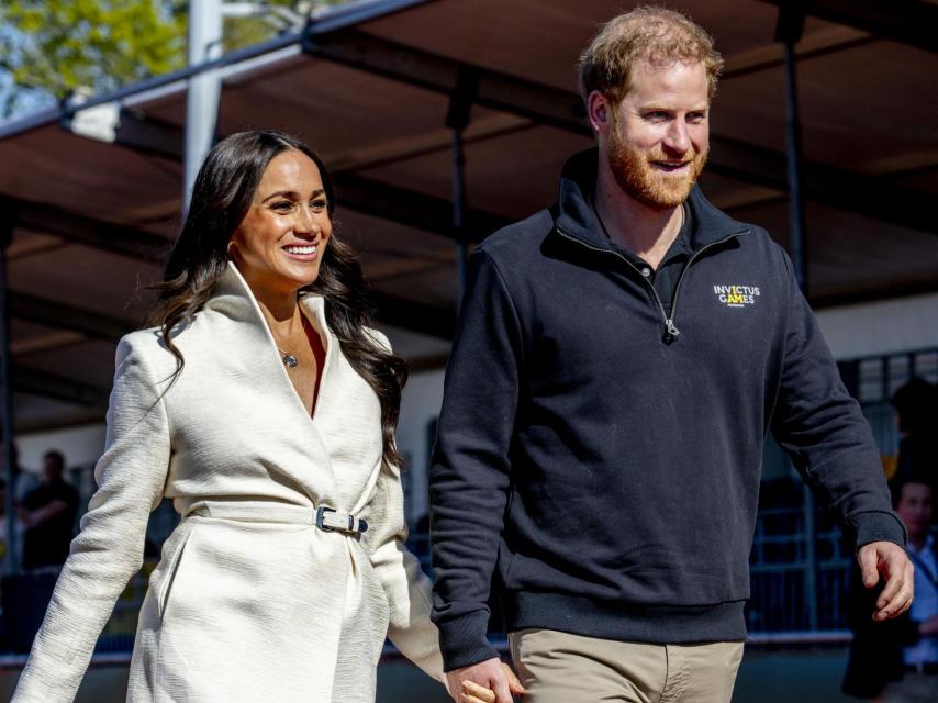 El príncipe Enrique de Inglaterra y Meghan Markle en una de sus últimas imágenes públicas.