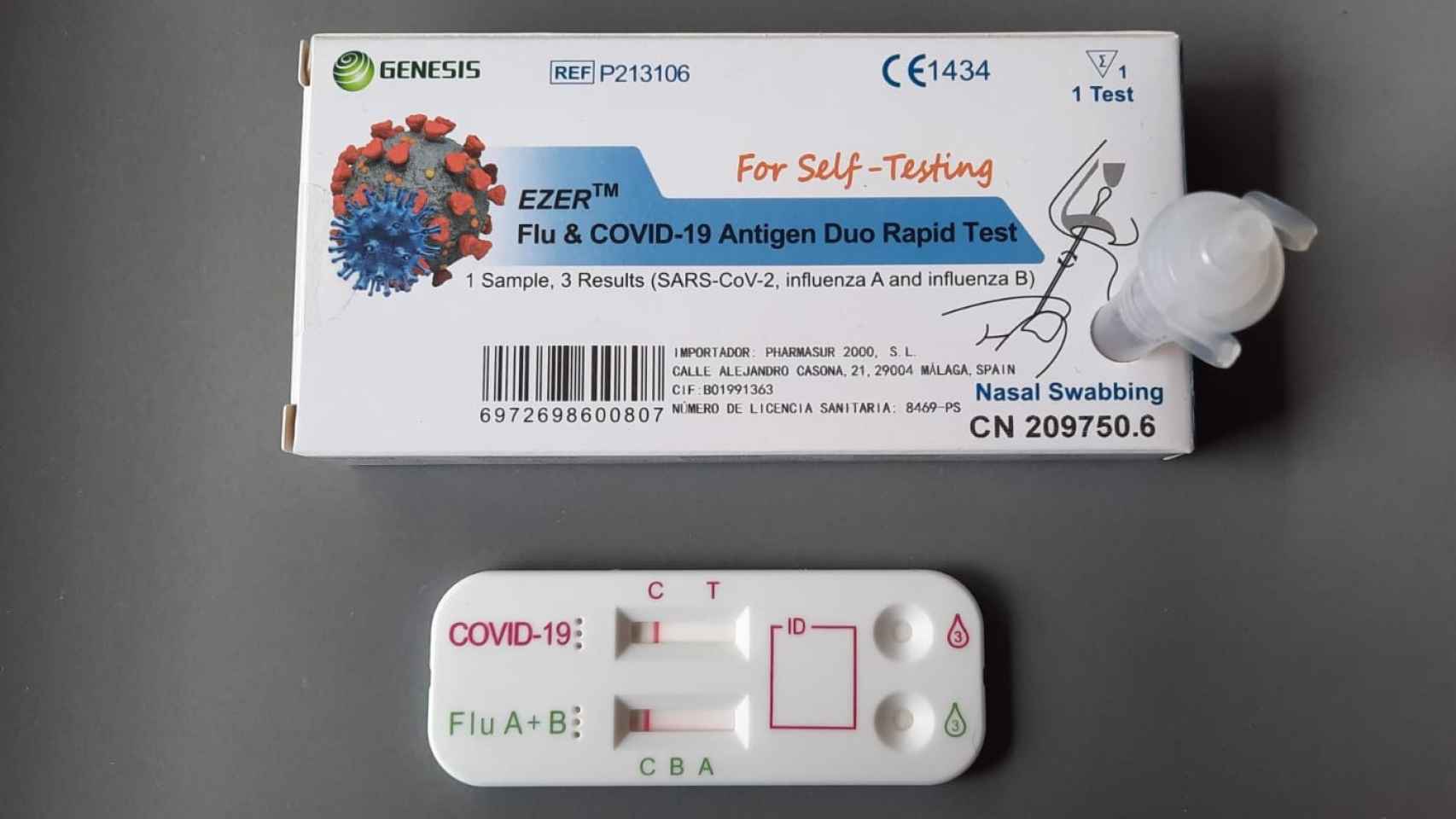 Una caja de los nuevos test de detección de Covid-19 y gripe y la tabla con doble resultado negativo.