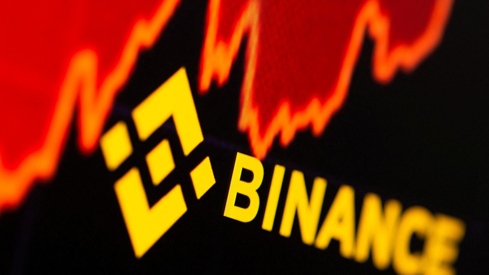 Logo de Binance sobre un gráfico de cotización.