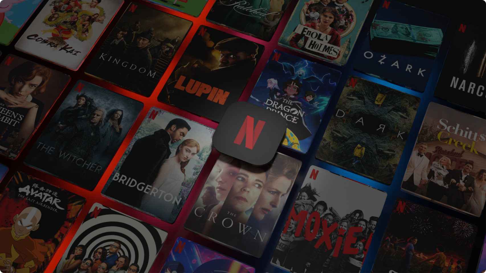 Logo de Netflix sobre varias imágenes promocionales de algunas de sus principales producciones.