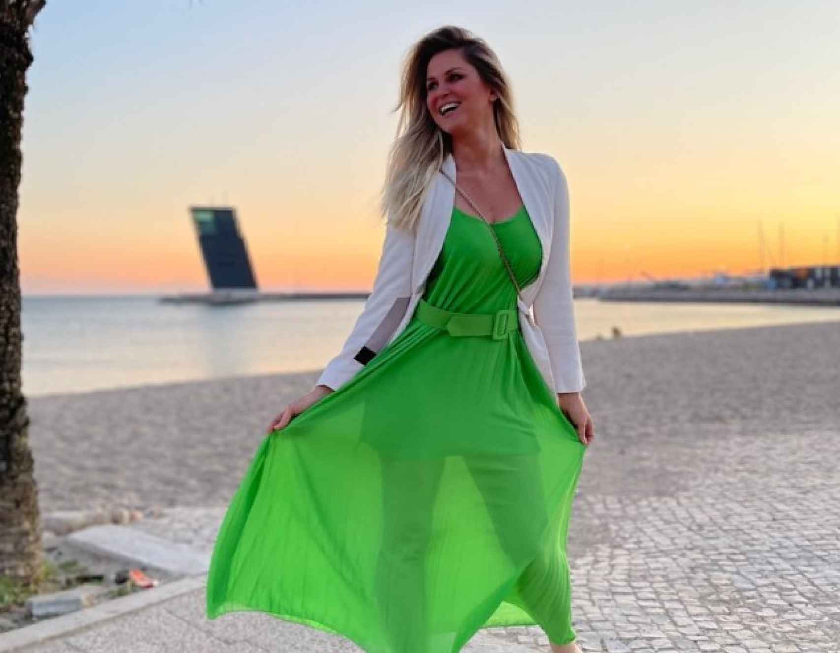 Susana Werner sonriente con un vestido verde