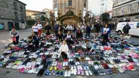 El millar de zapatillas que volarán hasta Gambasse.