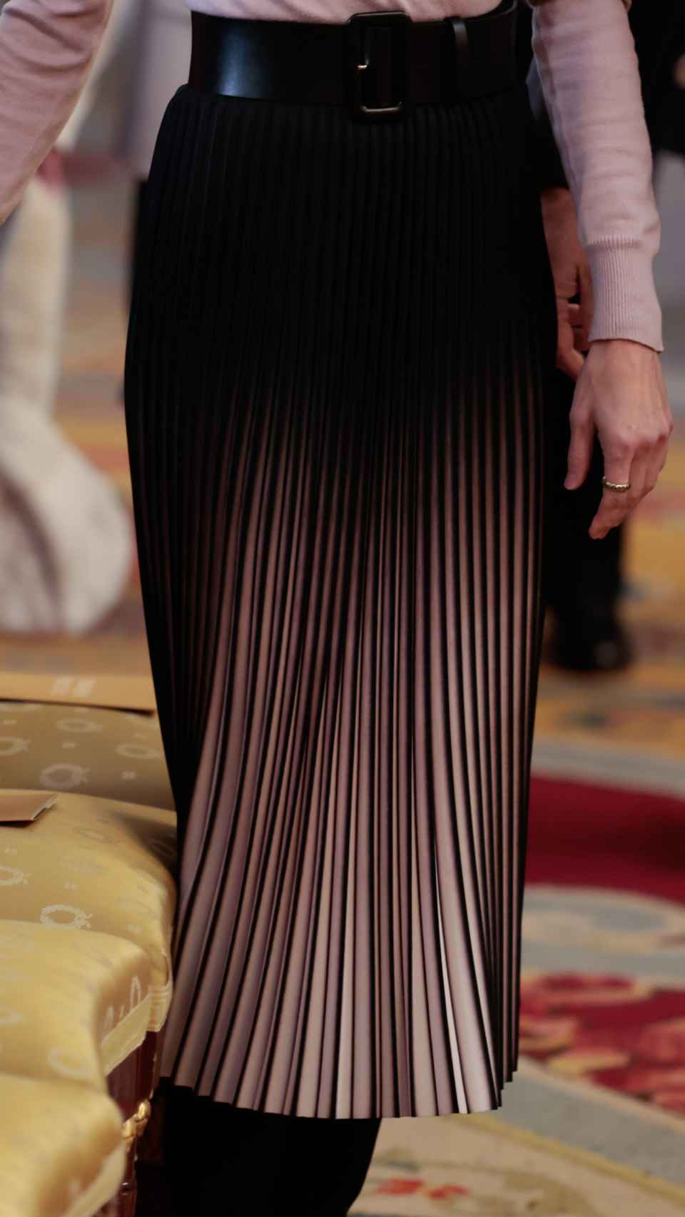 La falda plisada efecto fit de la Reina.