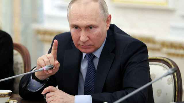 El presidente ruso, Vladimir Putin, durante su encuentro con corresponsales de guerra en el Kremlin.