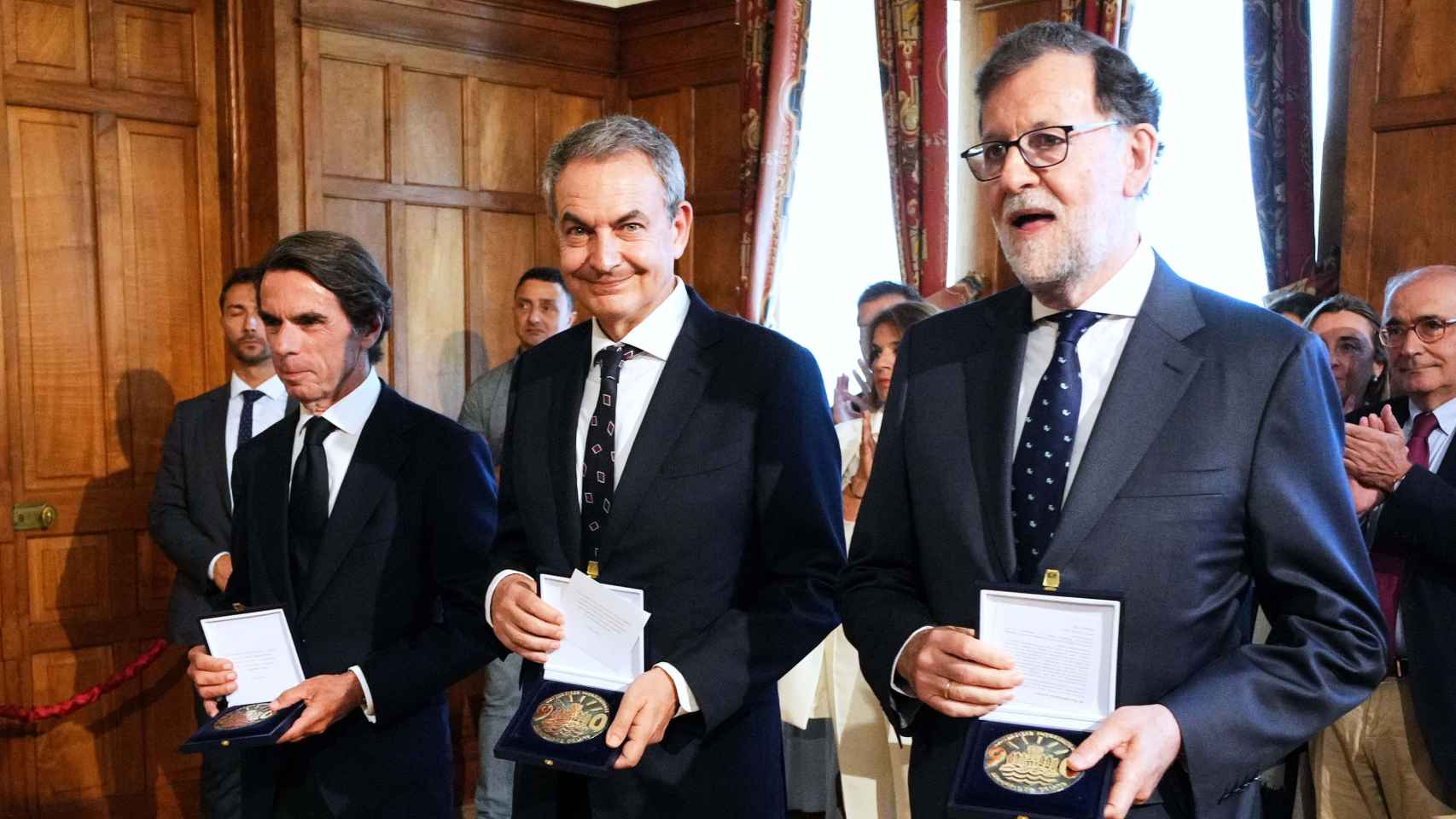 José María Aznaz, José Luis Rodríguez Zapatero y Mariano Rajoy, en un acto.