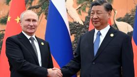 El presidente chino, Xi Jinping, y el mandatario ruso, Vladimir Putin, este miércoles en Pekín.