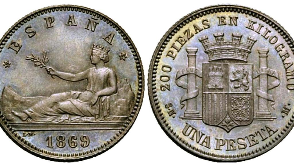 Moneda de una peseta con la palabra 'España'.