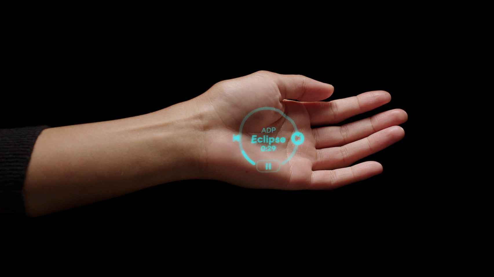 Imagen del AI Pin de Humane cuando refleja la interfaz en la palma de la mano del usuario