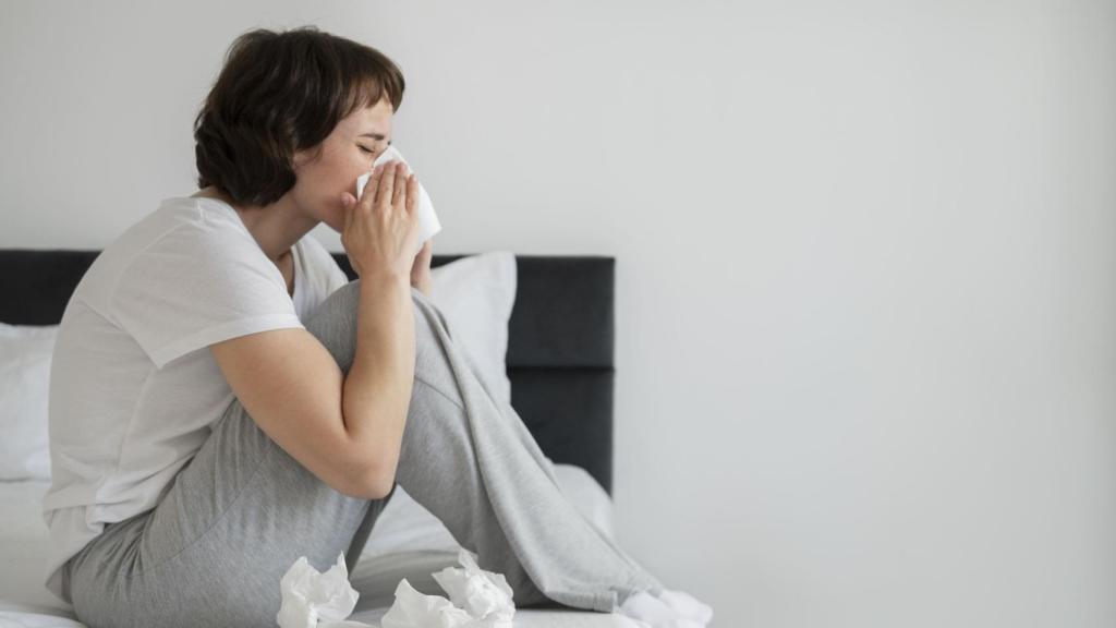 Mujer enferma en la cama.