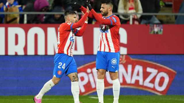 Portu y David López celebran el gol frente a Osasuna