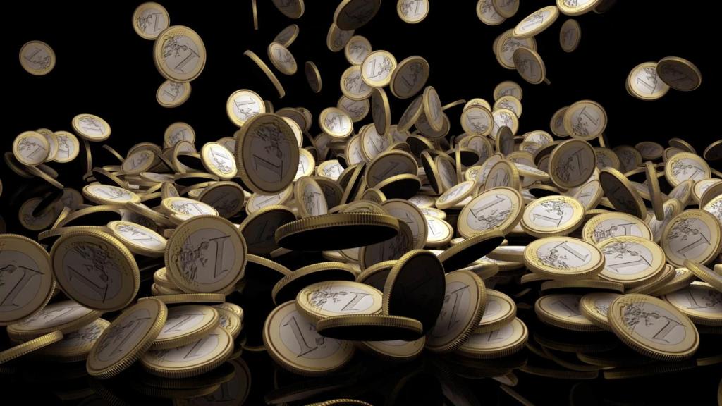 Muchas monedas de euro cayendo al suelo