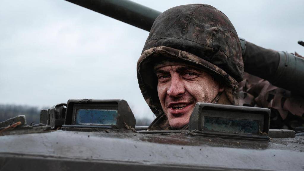 A Ukrainian recruit learns to drive a BMP armored vehicle near the Donetsk front.